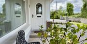 single bed, wardrobe, bedside table, countryside view