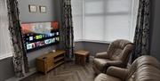 Lounge with seating and television