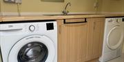 Utility with washing machine and tumble dryer