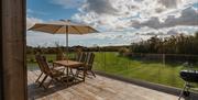 Outdoor seating area overlooking pretty landscape