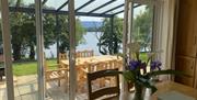 View from the kitchen of Shamrock Cottage, Kesh to the patio and beyond to the lake in Fermanagh, Northern Ireland