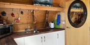 The kitchen area - equipped as almost a complete domestic kitchen but without a conventional over - air-fryer available instead.