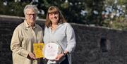 Catherine and Margaret standing in front of the Derry Walls