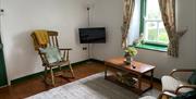 living room. rocking chair and SMART TV