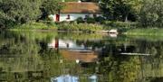 A longshot of the cottage over Keenaghan Lough.