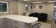 Open plan kitchen and living area with island and sofa