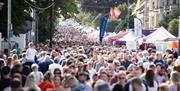 Crowds and stalls fill the street at the fair