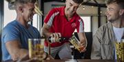 A couple of guys enjoy a pint of Long Meadow Cider produced on site