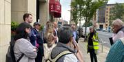 Mary Ann McCracken Walking Tour group and guide on street in Belfast
