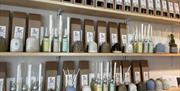 Shelf display of various hand made ceramic diffusers