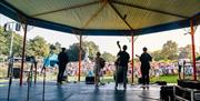 A band plays to the crowds at Music in the Park, Sundays in July and August