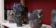 textured pots made from barrel-fired ceramics by Patricia Millar