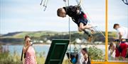 A boy on a trampoline enjoying the free children's entertainment on offer