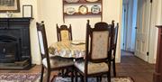 Image of the dining area and fireplace.