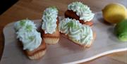 Rectangle buns decorated with cream and lime shavings