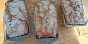 Wheaten bread in bread tins on baking tray