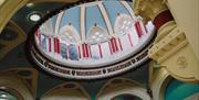 A close-up view of a decorative ceiling dome.