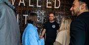 Group listening to the guide while enjoying the Beer Masterclass at the Walled City Brewery in Derry~Londondonderry