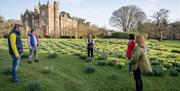 Group standing outside with Elmfield Estate in the background enjoying the Journey into Stillness experience