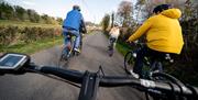 Group on electric bikes on a trail enjoying the Electric Escape experience with Corralea Adventure Centre