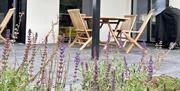 covered patio in the walled garden with Weber BBQ