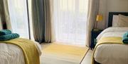one of the twin bedrooms complete with full height sliderobes for plenty of storage