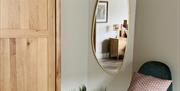 a glimpse of the master bedroom with kingsize bed and Egyptian cotton bedlinen
