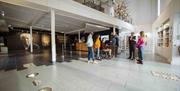 A group is welcomed into the Seamus Heaney HomePlace building