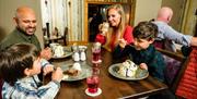 A family having a meal in the Valley Hotel