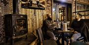 Two males chatting over a drink at The Bridge Bar