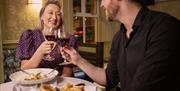 Couple having dinner at The Copper Tap