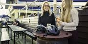 Two females enjoying a drink on the outside decking at the Dirty Duck