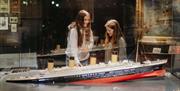 Two girls view the Titanic exhibit