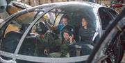 Family in cockpit of Alouette helicopter at the Ulster Aviation Society in Lisburn