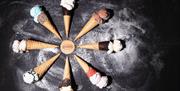 8 waffle ice cream cones on display, laid out in a circle, with a filling of delicious genoa homemade ice-cream.