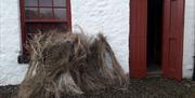 A pile of Flax, sitting beside the door of the Mill