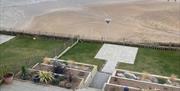 view of the beach from above the patio