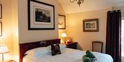 large superking bed in a stylish country style room