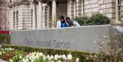 A couple at the Titanic memorial garden.