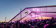 The Nomadic Stage in purple light as the sun sets
