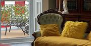 Image of a chair and bookcase full of books