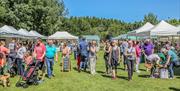 shoppers enjoying benone market