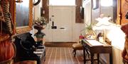 Entry hallway with chairs and dresser