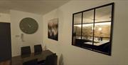 Image of dining room table and mirror on the wall