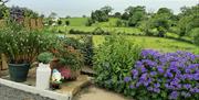 One view from the sitting room, revealling fields, the sea and great views of Scotland.