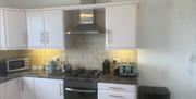 View of pink kitchen cabinets