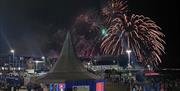 fireworks erupt in the distance over portstewart