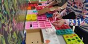 3 ladies in Midtown Makers workshop space learning how to make soap.