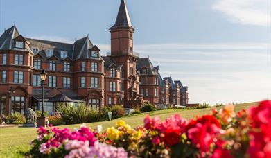 Slieve Donard hotel and ground with sun shining