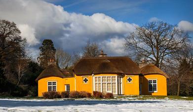 Image credit: Alan Hopps
Derrymore house. A bright yellow cottage with a thatched roof.